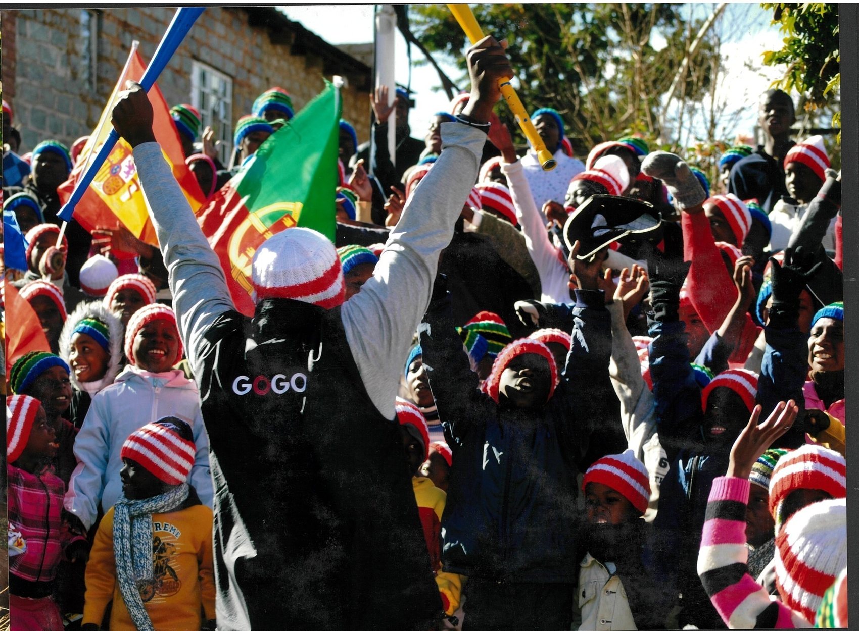The Gogo Trust team leading a beanie handout celebration, 2010 World Cup
