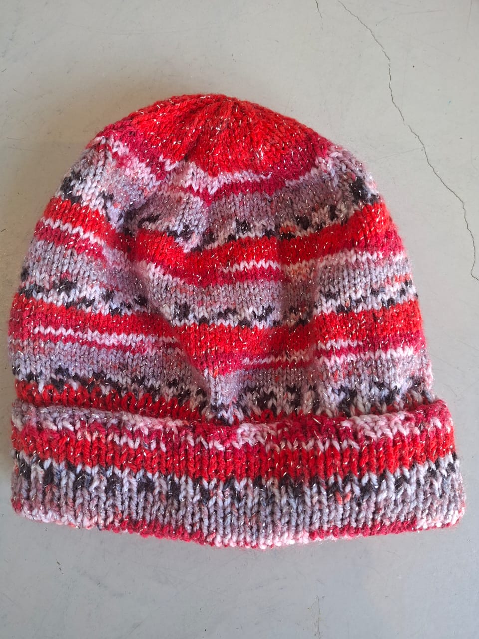 Red, pink and grey fleck beanie with metallic thread, hand-knitted at Kranshoek