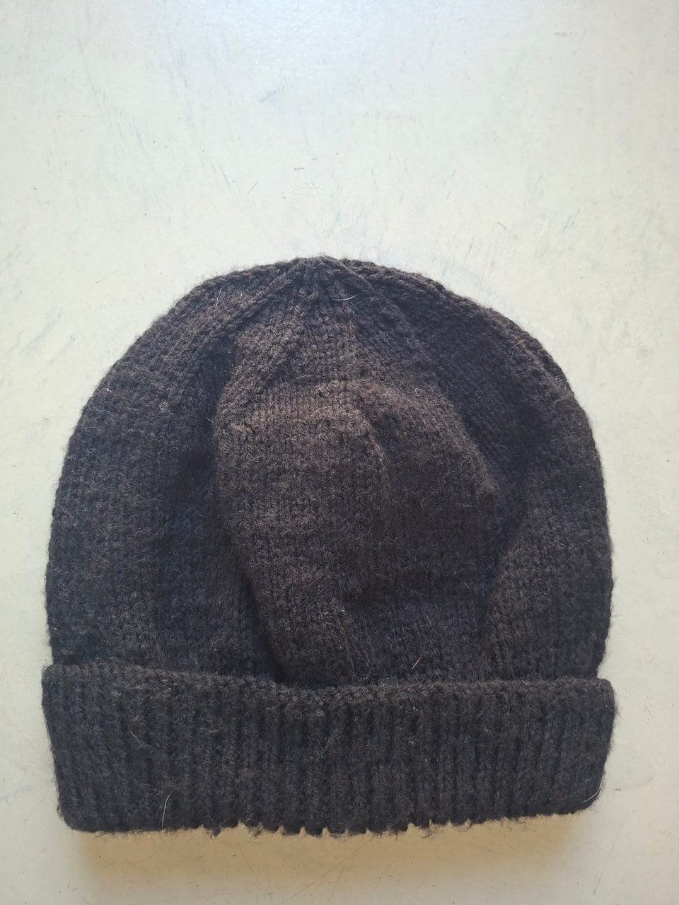 Solid dark coffee brown beanie, hand-knitted at Kranshoek