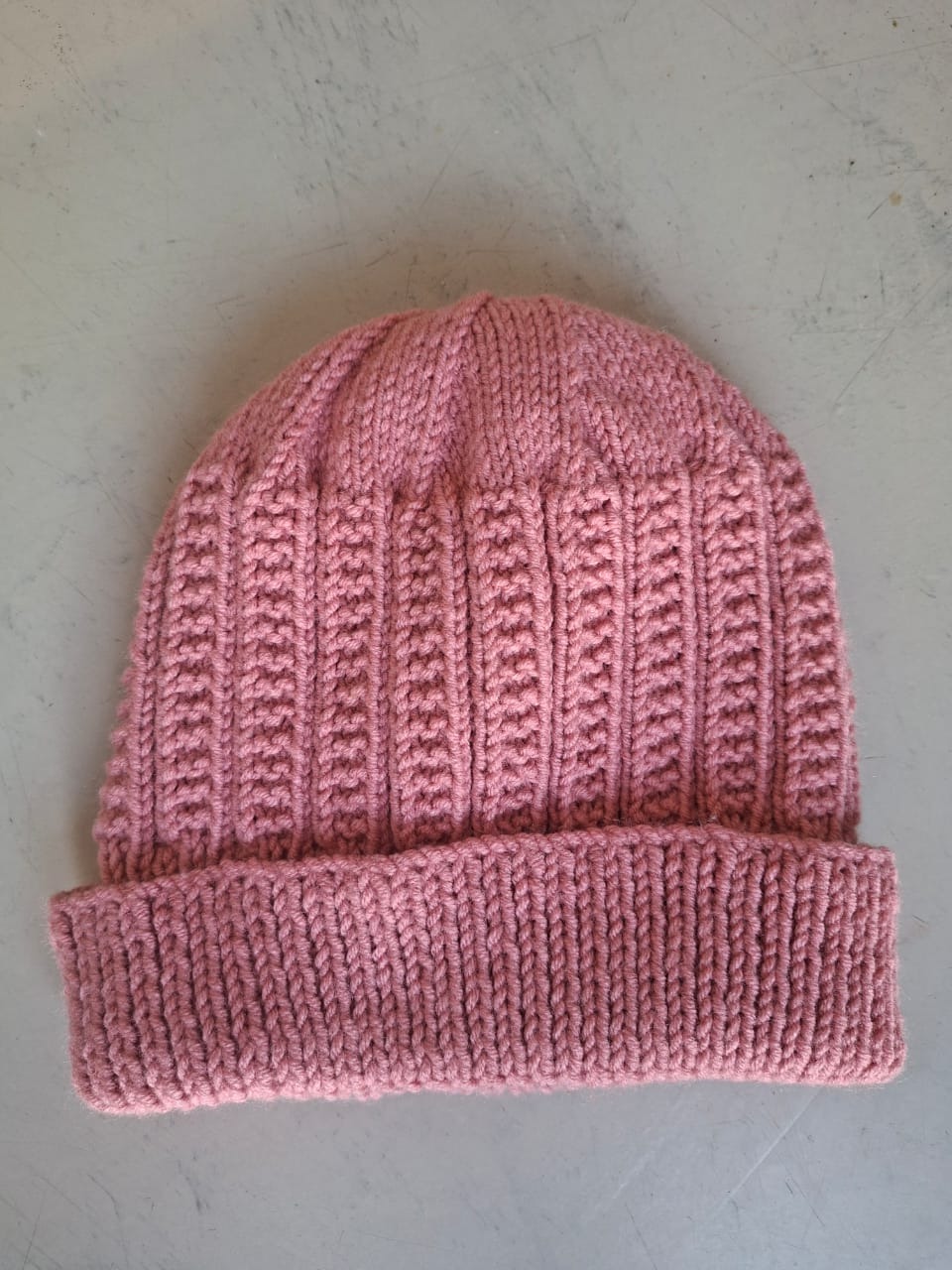 Dusty rose ribbed beanie, hand-knitted at Kranshoek