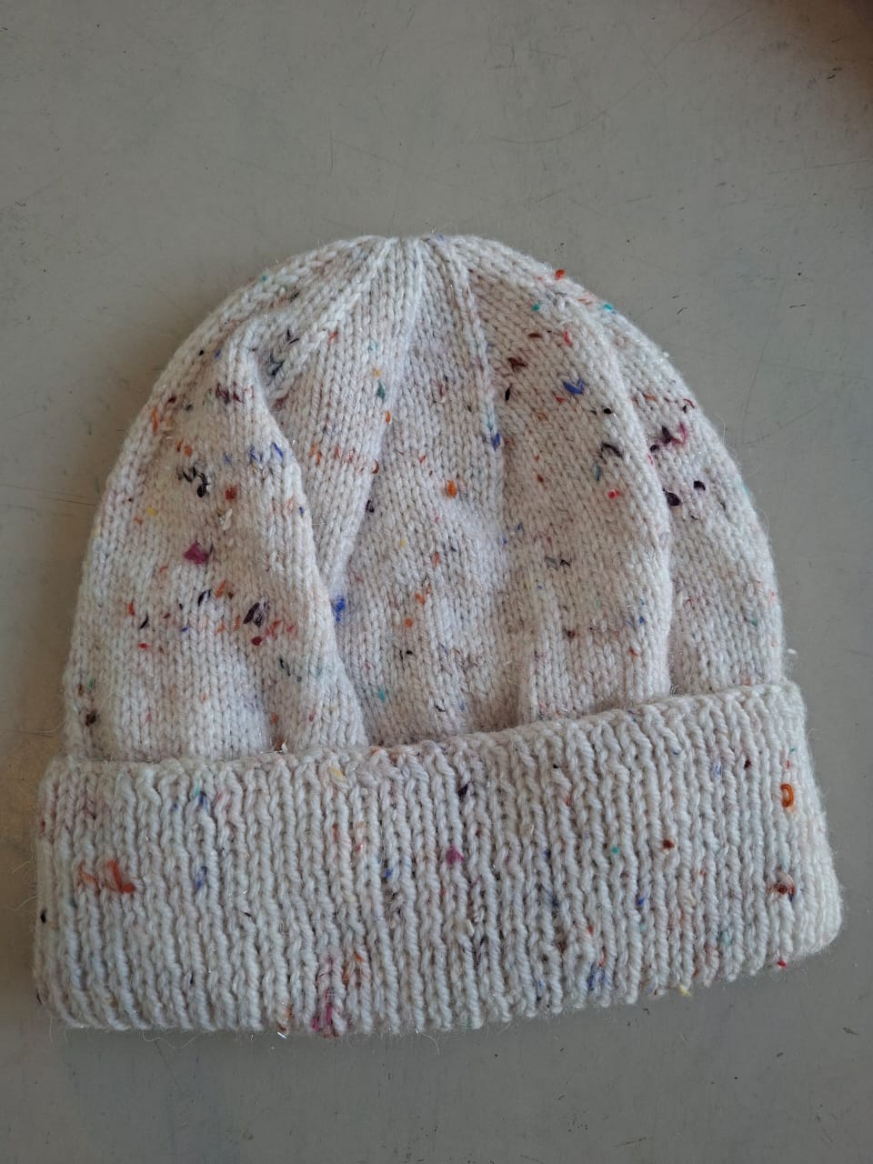 Cream fleck beanie, hand-knitted at Kranshoek