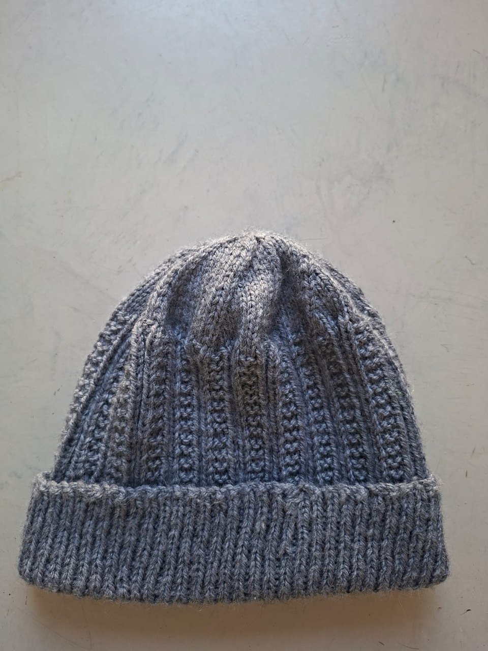 Solid mid grey ribbed beanie, hand-knitted at Kranshoek