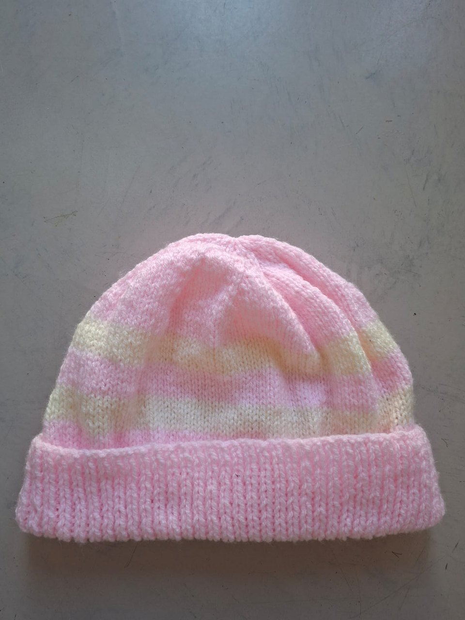 Pink variegated beanie with lemon and green flecks, hand-knitted at Kranshoek